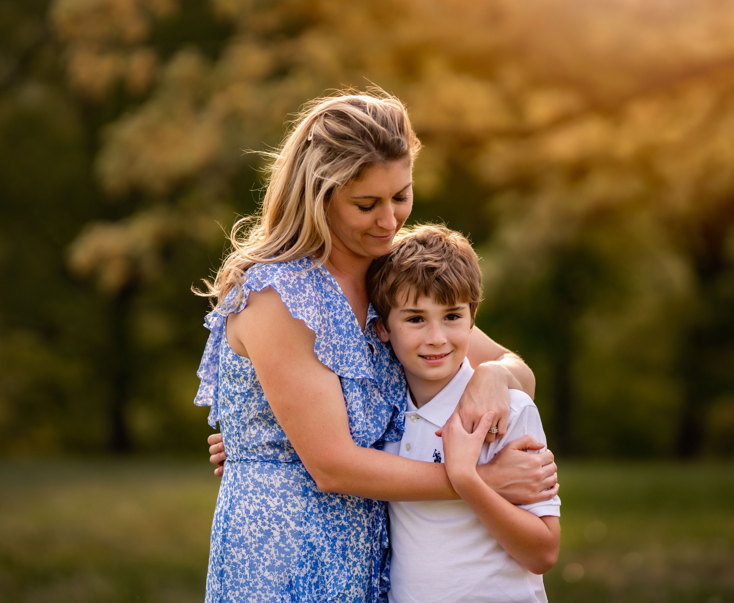 Mom and son hugging at sunset Family photographer in Asheville, NC