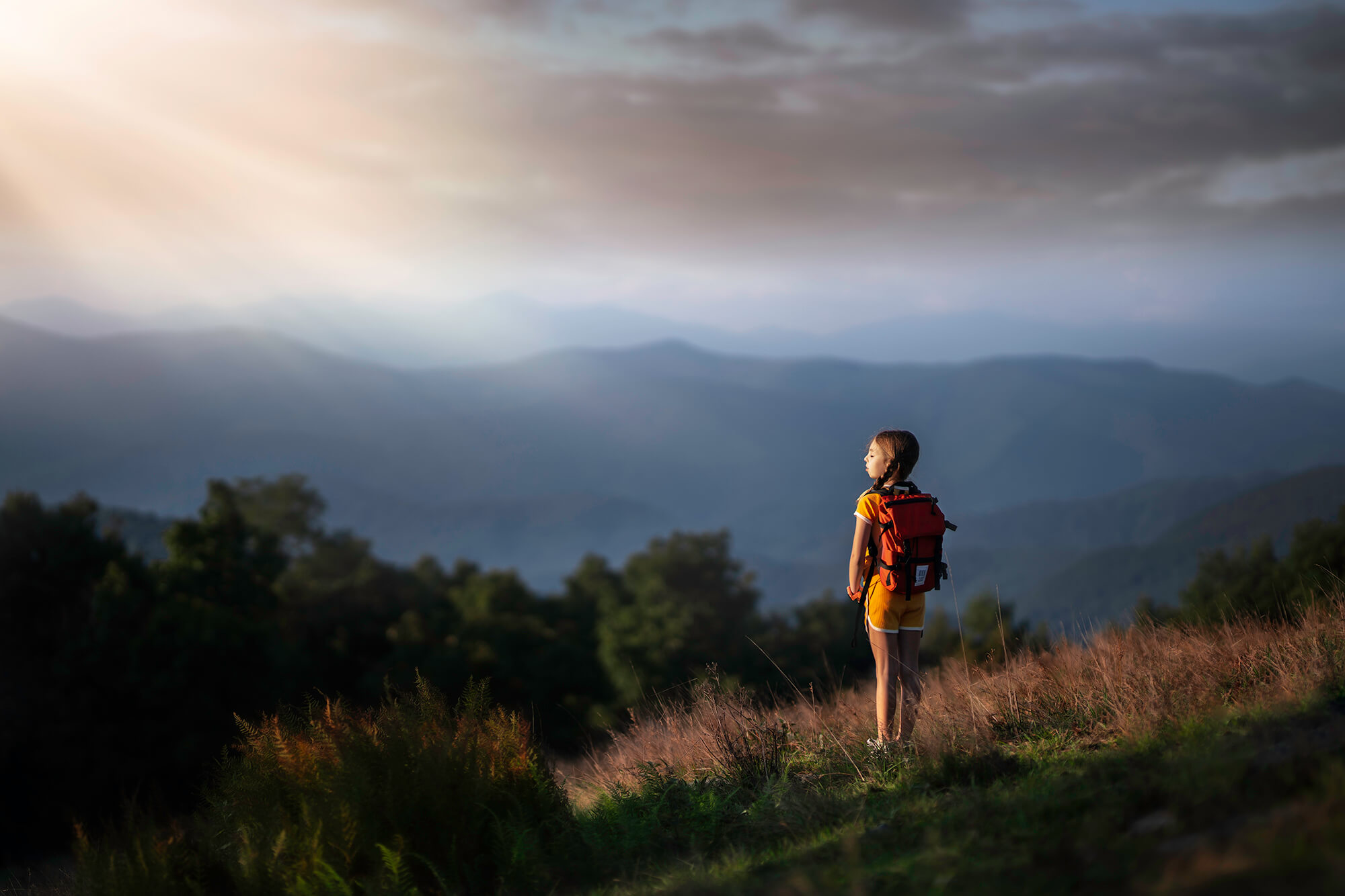 a young girl hiking in the mountains as a fun thing to do in Asheville with kids.