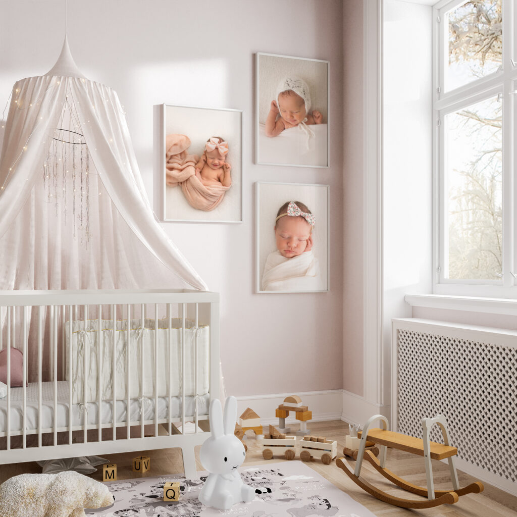 A gallery wall of newborn photos from an Asheville Family Portrait Sessions hangs in a nursery beside the crib