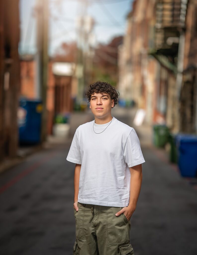 high school senior boy photographed in an urban setting in asheville nc